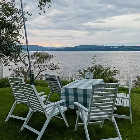Peaceful Log By The Fjord On *