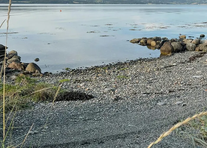 Ferienhaus Peaceful Log By The Fjord On